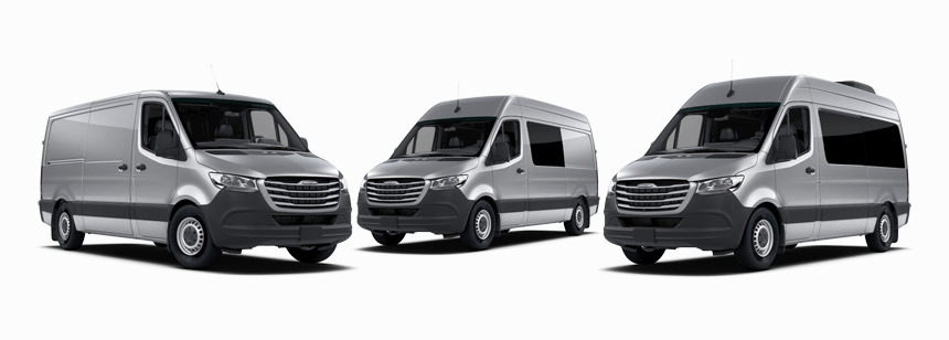 View of three different Freightliner vans.